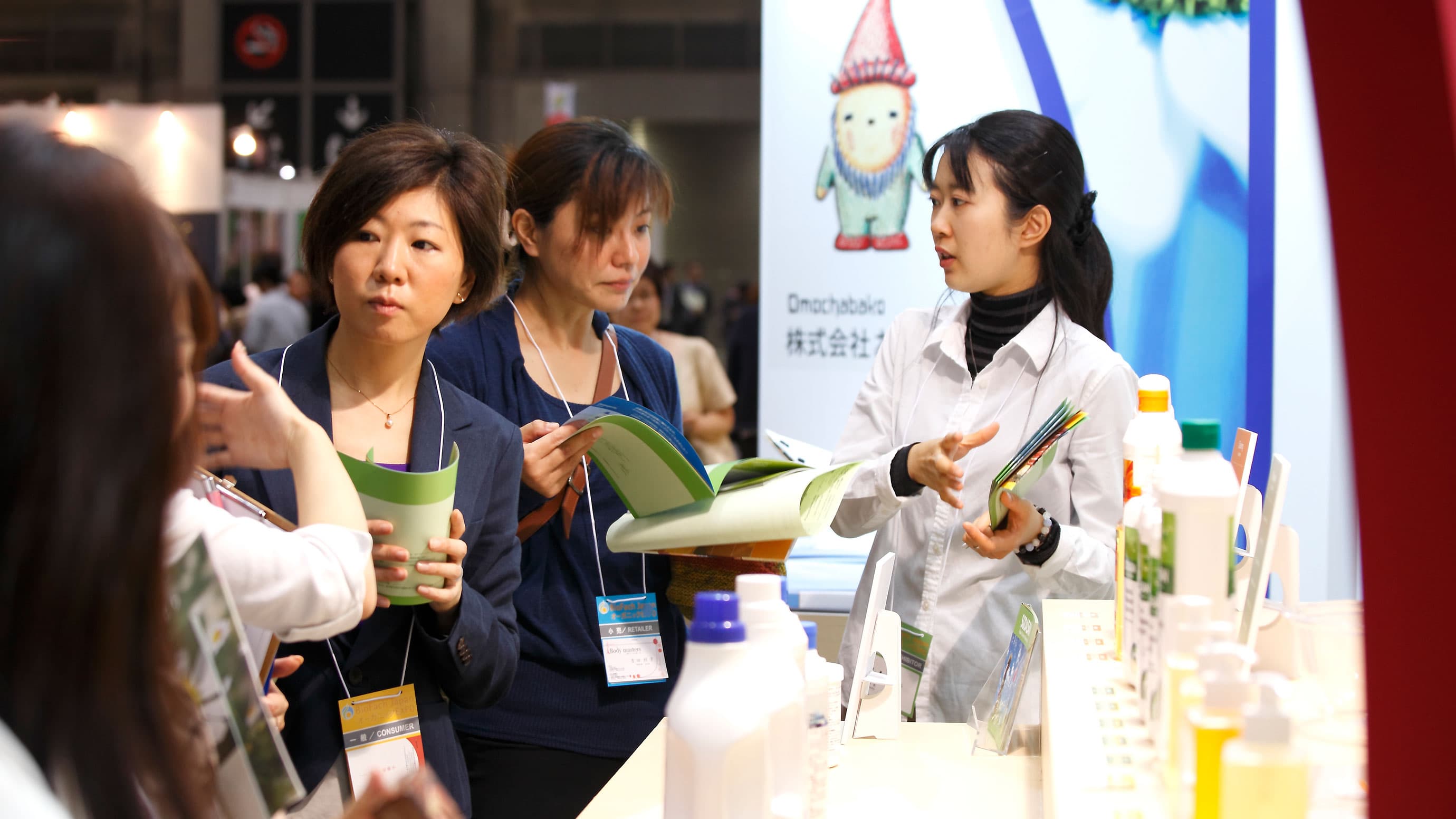 Exhibitor booth with visitors