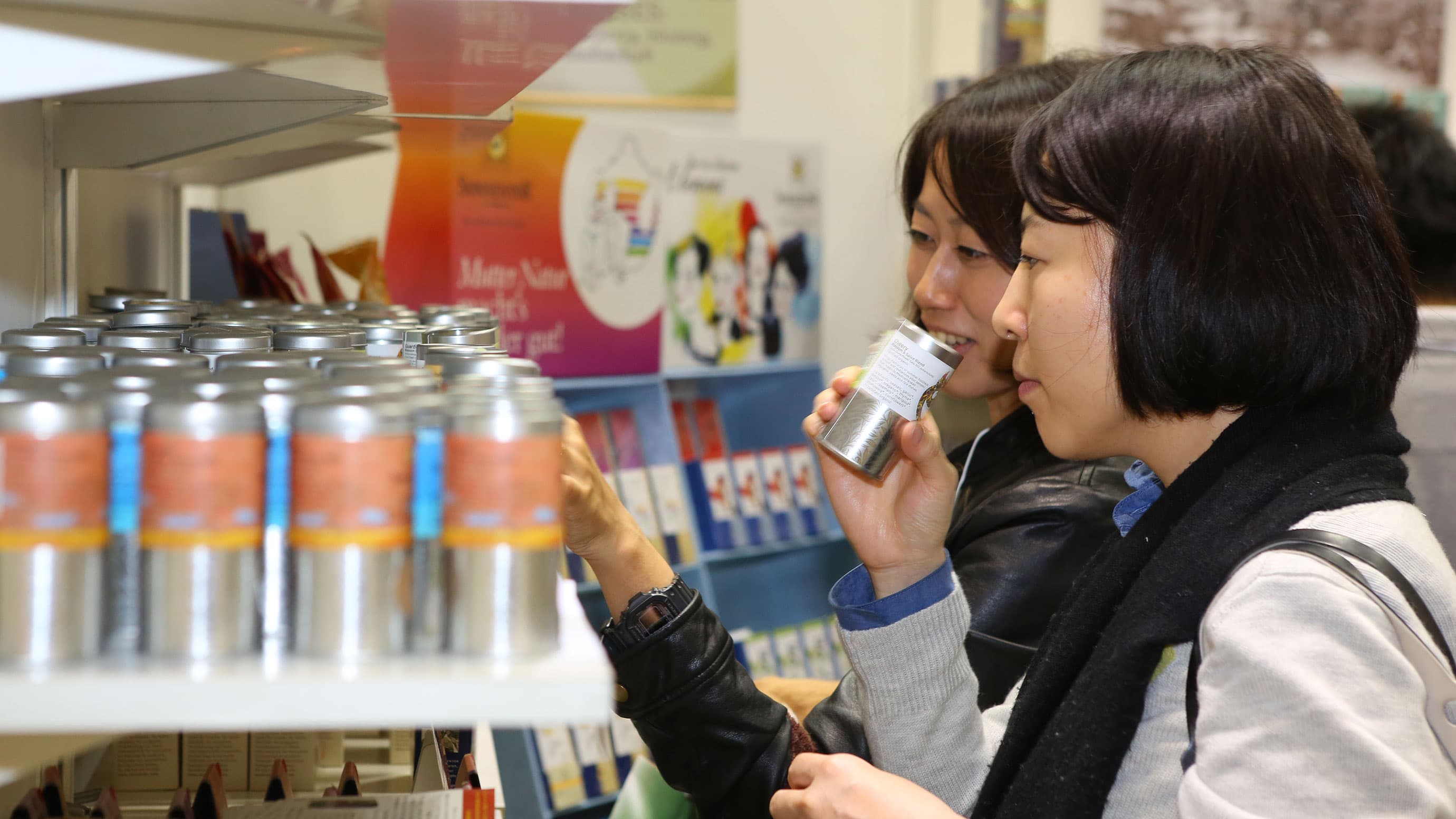 Visitor smelling a product